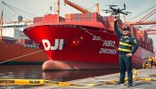 red_china_cargo_ship_named_dji_with_a_big_chinese_flag_sticker_on_the_hull_wrapped_in_big_cha...jpeg