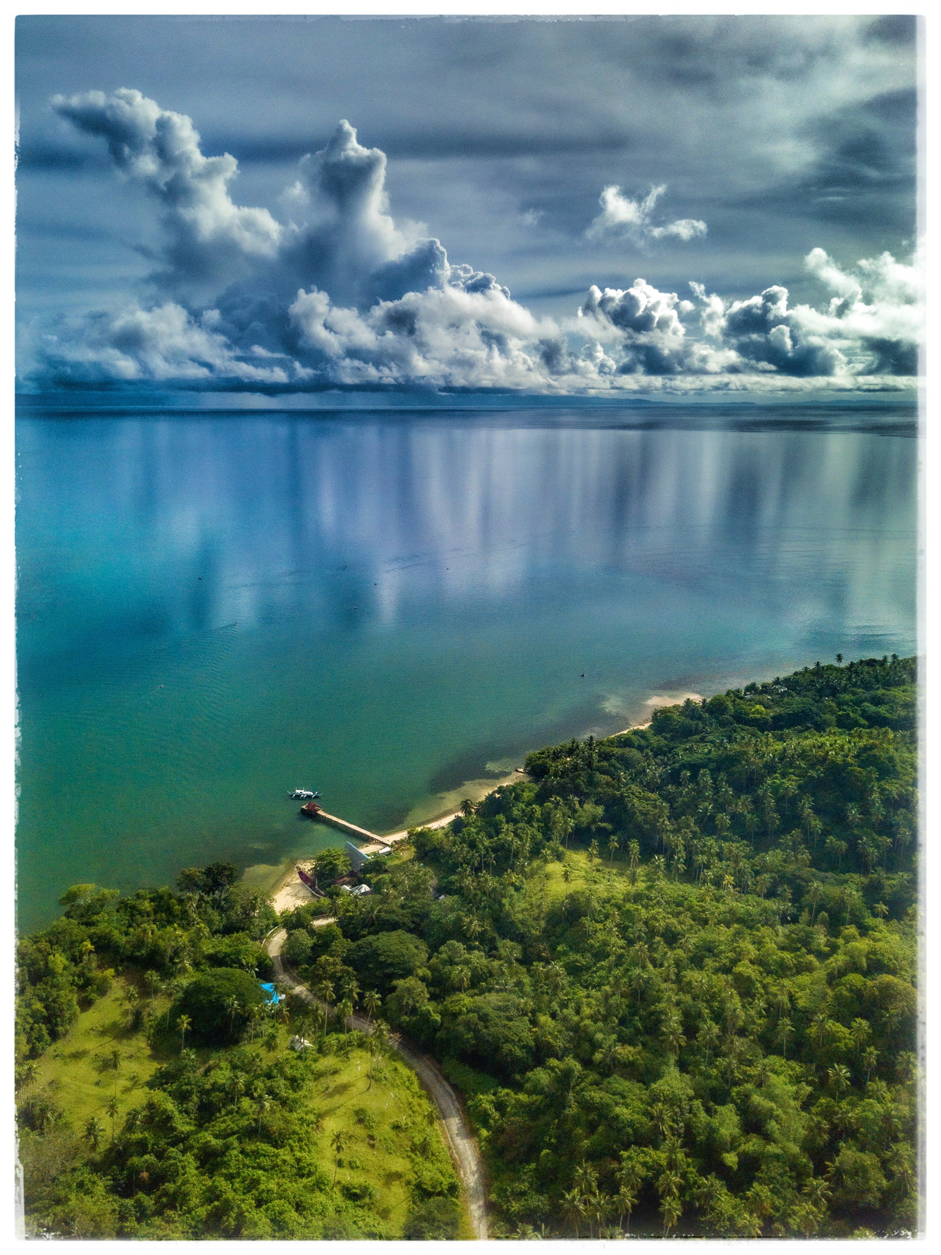 2025.09.14 07:44 Rain in the Distance Mirrored in Ocean