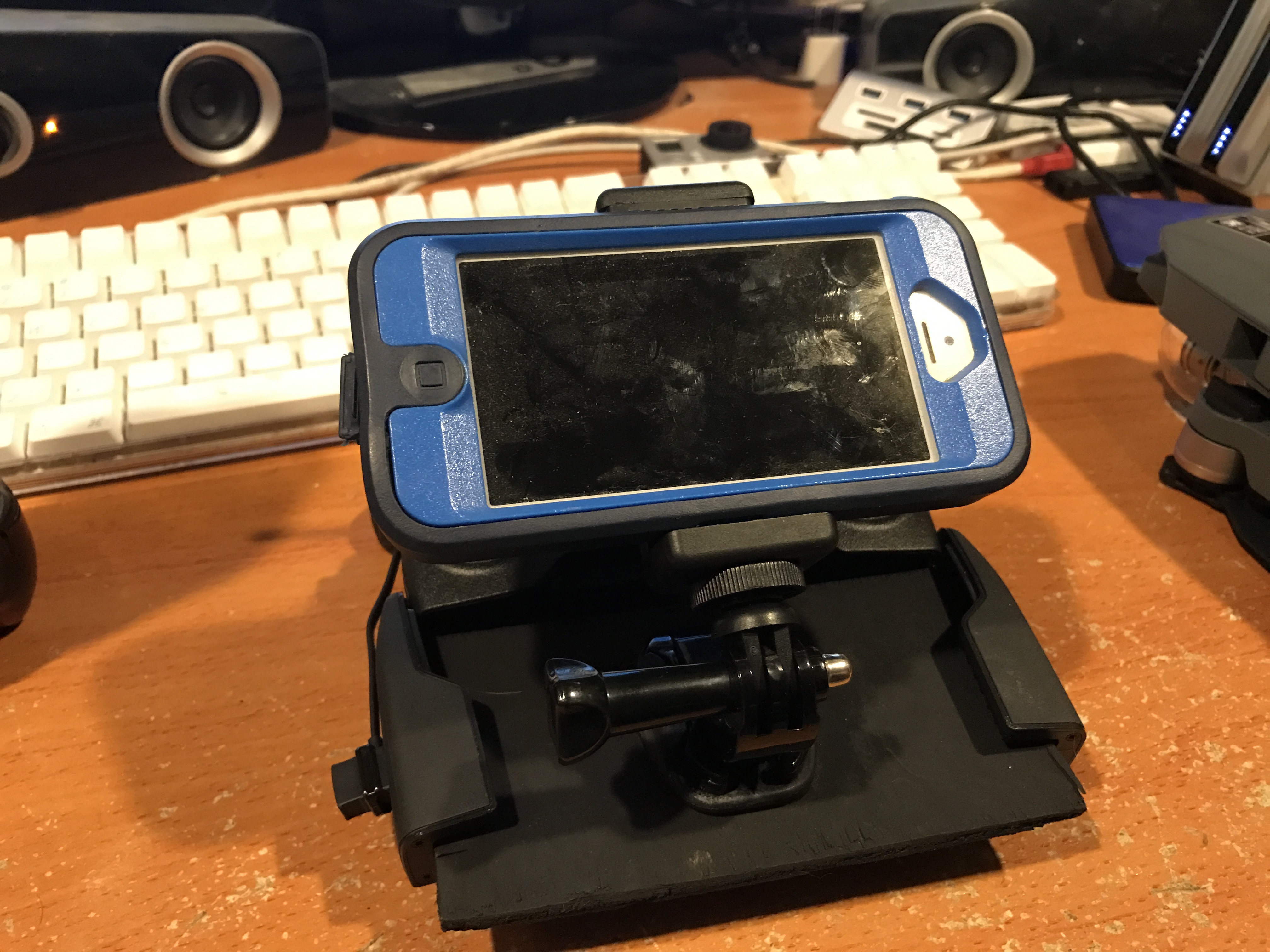 Holder with old iPhone with Otterbox case