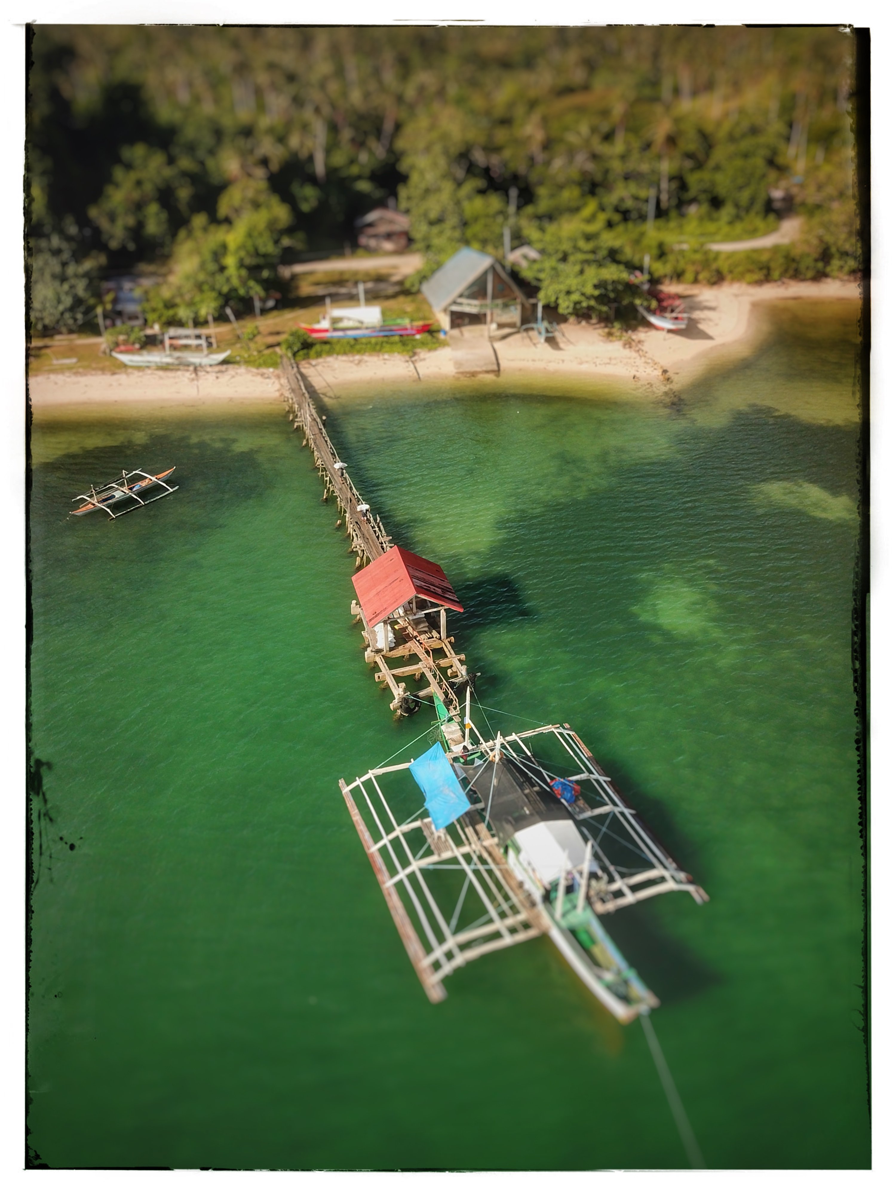 My pier while we load dried coconut for delivery